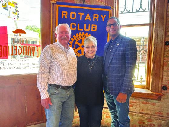 SILVER EAGLE SOCIALS DISCUSSED -  Shown, from left, are Rotarian Brent Coreil, Silver Eagles President Rhonda Lafleur and Rotary President Brian Ardoin. (Gazette photo by Heather Bogard)