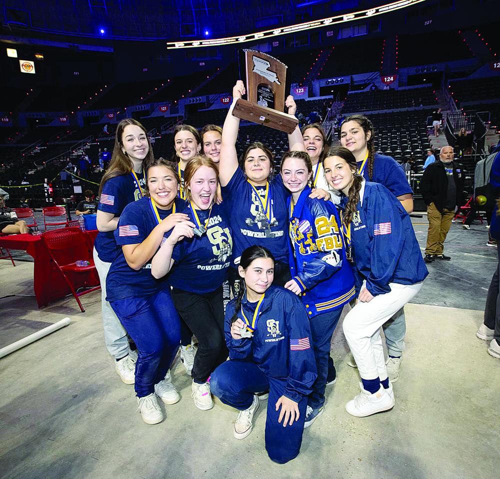 The 2024 Girl’s Division V State Powerlifting Runner-up Sacred Heart Lady Trojans are pictured with the trophy. The team finished with 37 points behind Cedar Creek with 66 points. Among those pictured are Madeline Fuselier, Karlee Lafleur, Adeline Launey, Eliza LaHaye, Lily Deshotel, Ali Fontenot, Abbie Quibodeaux, Abbie Perrodin, Haley Dupre, Camille Buller, and Blakelee Thibodeaux. (Gazette photo by Angela DeVille)