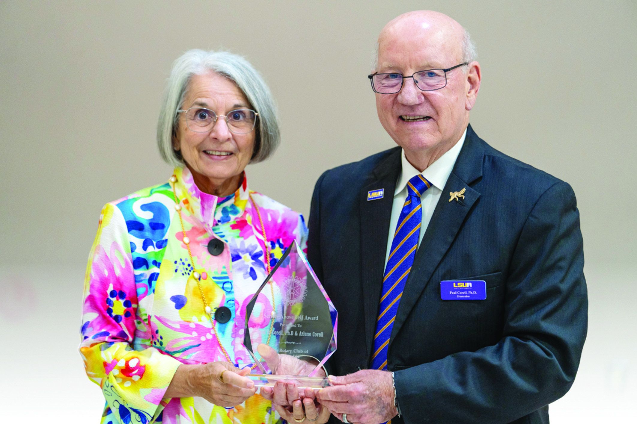 Arlene (left) and Paul Coreil (right) are pictured with their 2026 Service Above Self Award, which was presented by the Rotary Club of Alexandria. (Photo by Nathan Parish)