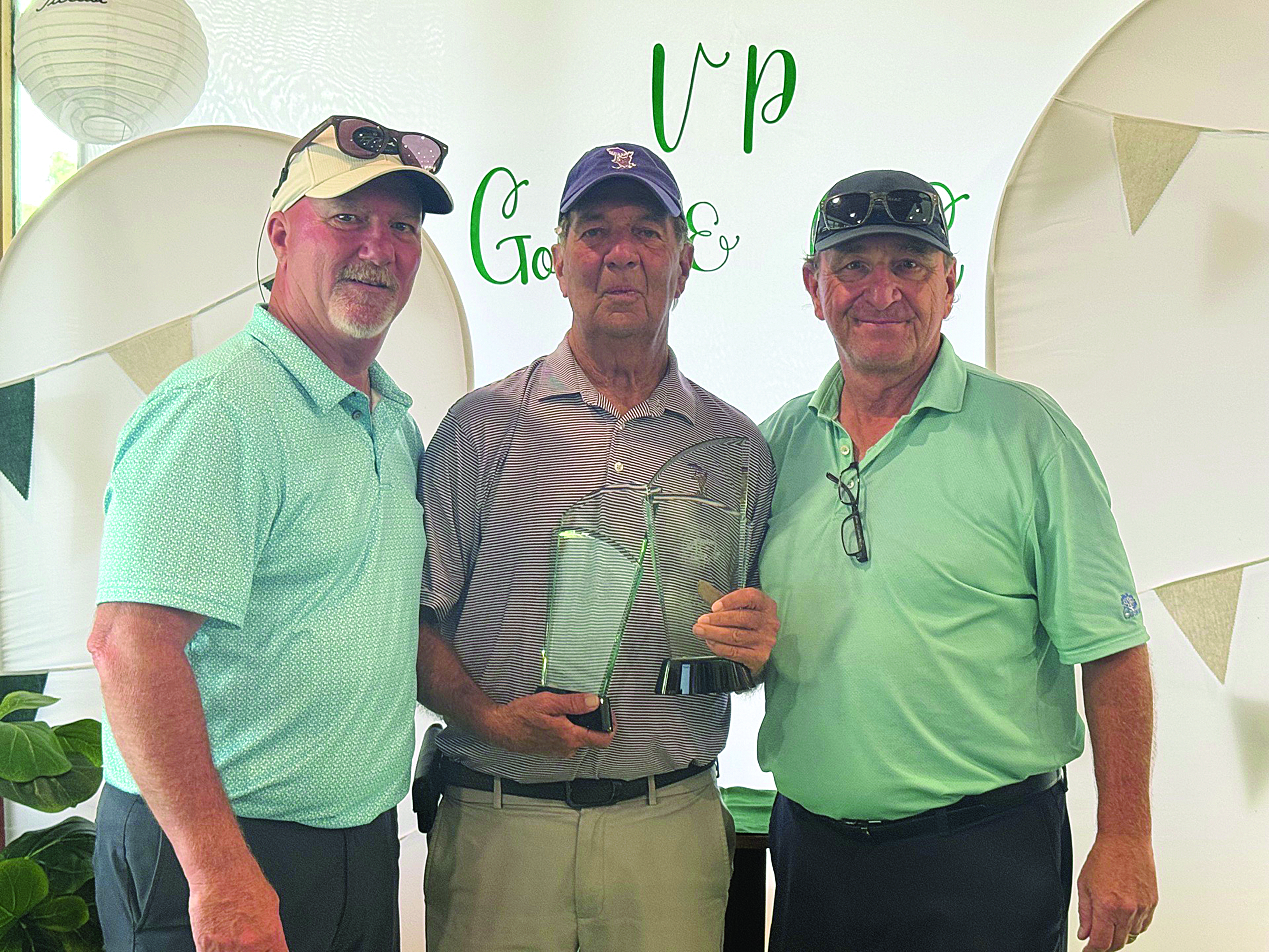 Ted Smith is pictured in the center with his trophies after winning the Ville Platte Golf and Country Club Championship. He is pictured with board member Brian LaFleur on the left and President T-Joe Fontenot on the right. (Photo courtesy of Ted Smith)