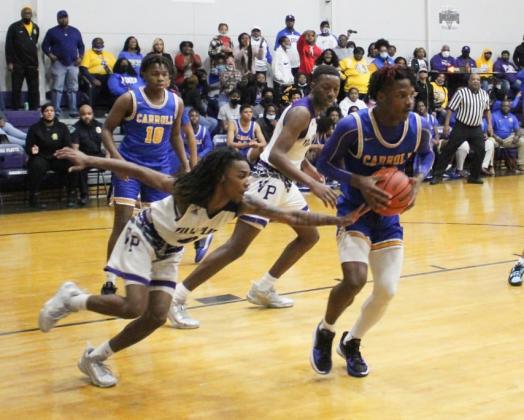 Davontae Fontenot (0) attempts to steal away the basketball in the Bulldogs’ game against Carroll. (Photo courtesy of VPHS)