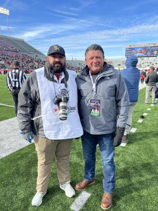 Ville Platte Gazette editor Tony Marks (left) is pictured with former LSU football coach Ed Orgeron (right) on the sideline of the Radiance Technologies Independence Bowl played in Shreveport on Friday, December, 23. (Photo submitted)