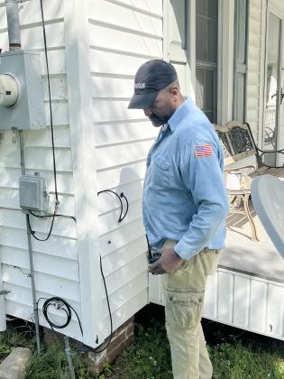 Ville Platte Chief of Police Al Perry Thomas inspects a residence on the 600 block of East Washington Street. (Gazette photo by Tony Marks)