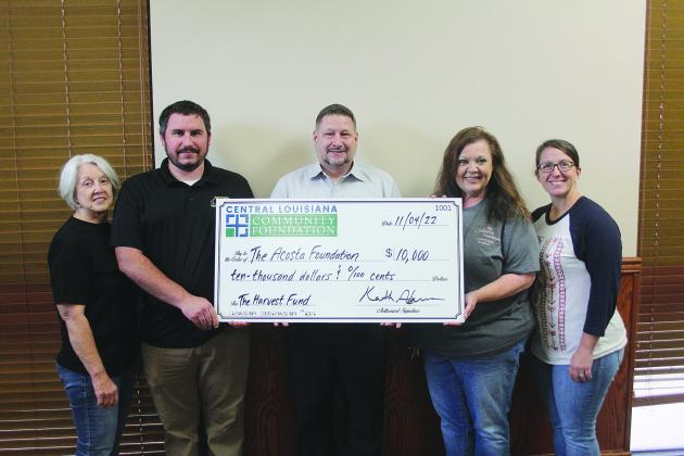 Pictured (L-R) Dr. Gwen Fontenot, Acosta Foundation board member/advisor; Luke Deville, Manager, Teet’s Food Store; Keith Adams, President & CEO of Central Louisiana Community Foundation; Connie Lamke, President of the Acosta Foundation; and Heidi Jeanmard, Acosta Foundation Board Member/Secretary-Treasurer. (Gazette photo by Tony Marks)