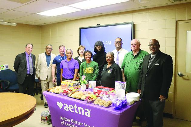 From left are (back row) Assistant Superintendent Mike Lombas, Roy Serie, Eric Fontenot, Ann Kay Logarbo, Torren LaFleur, Tommy Jones, School Board President Bobby Hamlin, and Superintendent Darwan Lazard; (front row) Amber McCoy, Maegan Moore, and School Board Vice President Sheila Joseph. (Gazette photo by Tony Marks)