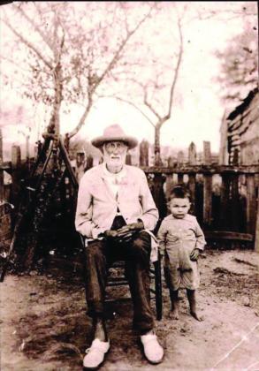 Auguste Louis Jeansonne (left) is pictured with one of his young family members. He was a Confederate soldier who had at least 23 children and over 100 grandchildren. He was also a sharecropper who passed away 100 years ago and is buried on the property he farmed in L’Anse Aux Pailles. (Photo courtesy of Carissa Morgan)