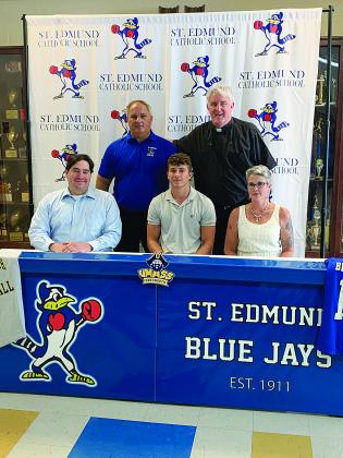 Bayou Chicot’s Easten Coleman signed to play football with University of Massachusetts Dartmouth. He is pictured seated in the center with his father Matt Coleman (left) and mother Jodi Crosby (right). Standing from  left are St. Ed’s Coach James Shiver and St. Anthony of Padua Pastor Fr. Hampton Davis. (Gazette photo by Rhett Manuel) 