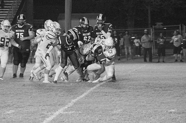 The Ville Platte High offense keeps churning against a vaunted Iota defense in a loss last week to open up district play. Coach Roy Serie’s Bulldogs will now take on Pine Prairie tonight. (LSN photo courtesy of Chris Quebedeaux)