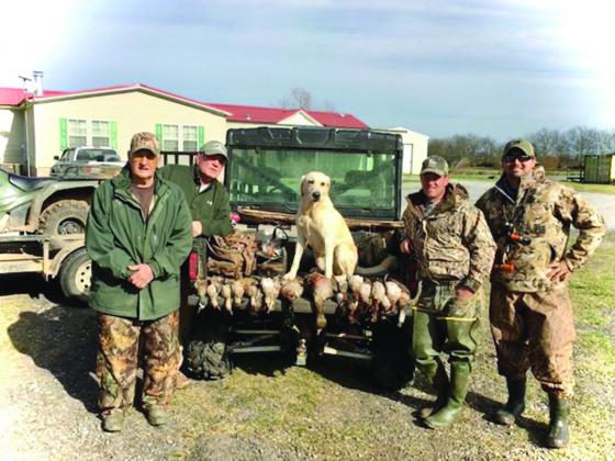 Pictured from left are James C. “Dino” Fontenot, Timmy Sylvester, Dr. Brandon Fontenot, and Mike Poole following a duck hunt years ago. (Photo courtesy of Dr. Brandon Fontenot)