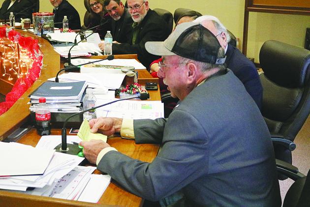 Evangeline Parish Police Juror from District 2 Sidney Fontenot reads the engineer’s report en français for parish engineer Ronnie Landreneau during the French meeting held Tuesday, December 12. (Gazette photo by Tony Marks)