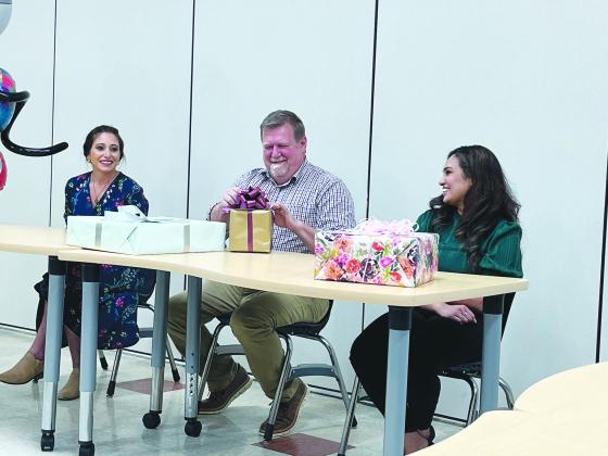 GIFTS PRESENTED - Jackie Prudhomme (left), elementary teacher at Chataignier Elementary and district winner; Chataignier Elementary junior high teacher and state semi-finalist Tim Comeaux (center); and Deepthi Nalli (right), Ville Platte High School teacher and district winner received gifts from the school board in recognition of their hard work during the contest. (Gazette photo by Heather Bogard)