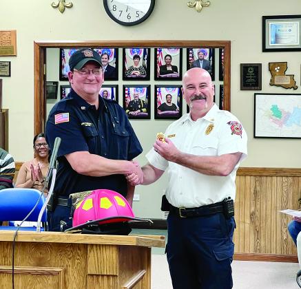 Fire Chief Chris Soileau promoted and pinned Kirk Fontenot as a probationary captain of C Shift. Soileau also presented Fontenot with his new red helmet which indicates line officers. Fontenot has been a full-time operator with the Ville Platte Fire Department since 2010. (Gazette photo by Nancy Duplechain)