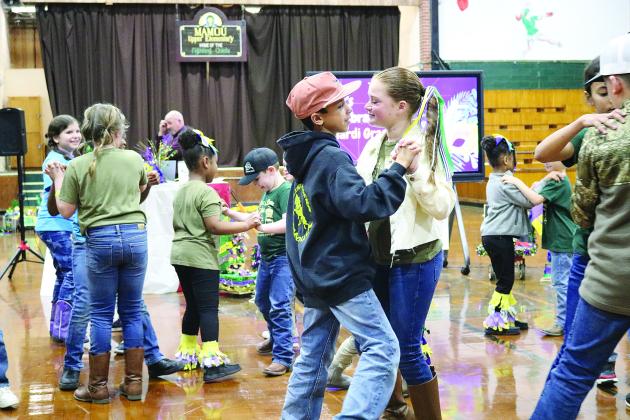 Mamou Elementary French Immersion students dance to a live Cajun band during the school’s French Night on February 8. (Gazette photo by Tony Marks)