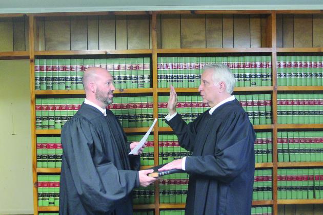 TAKING the OATH – Ville Platte City Judge Greg Vidrine gives the oath of office to newly elected Appellate Judge Gary Ortego of Ville Platte. (LSN photo by Tony Marks)