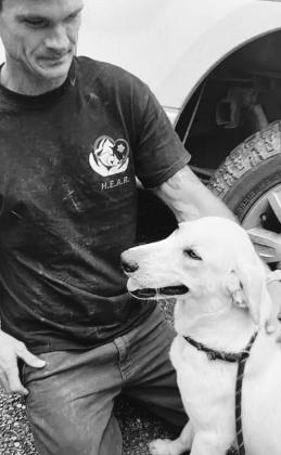 Matt Baker, president of Heroes Everywhere Animal Rescue (HEAR) poses with Tinker, one of the 60 plus rescues left in the Bakers’ care. 