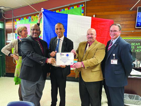In the left photo (from left) are Evangeline Parish Superintendent Darwan Lazard, Rodolphe Sambou (Consul General of the French Republic in New Orleans), Mamou Elementary Principal Troy Fontenot, and Evangeline Parish Assistant Superintendent Mike Lombas.