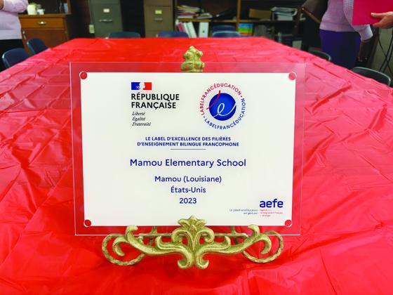 In the right photo is a close up of the special award presented to Mamou Elementary’s French Immersion program. (Gazette photos by Heather Bogard)
