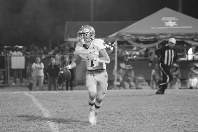 Hayden Droddy (7) eyes a target in the game against Opelousas Catholic last week. Droddy and the rest of the Trojans ended the regular season with a win against North Central on homecoming night and will learn their postseason fate today when the brackets are revealed. (Gazette photo by Rhett Manuel)