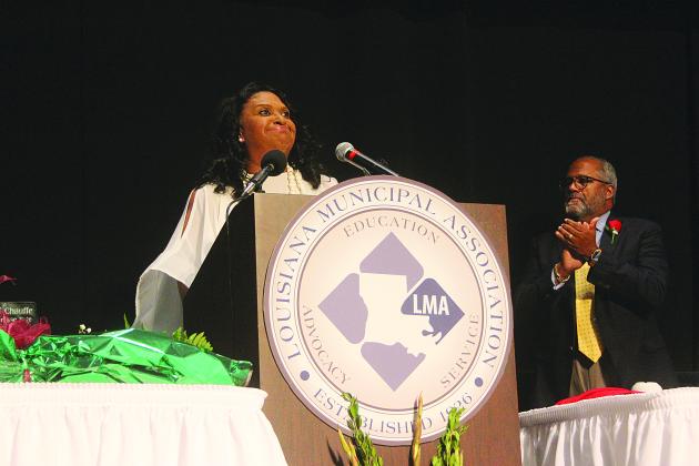 Ville Platte Mayor Jennifer Vidrine (left) delivers her remarks after being installed as the first black president of Louisiana Municipal Association. Also pictured is U.S. Congressman Troy Carter, the lone African-American and Democrat in the Louisiana congressional delegation. Gazette photo by Tony Marks