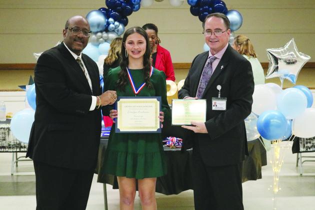 From left are Superintendent Lazard, MJH 8th grade JAG student of the year Danilynn Landreneau, and Assistant Superintendent Lombas.