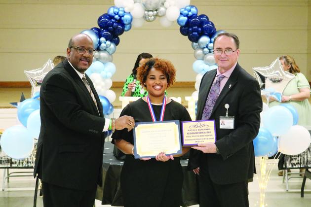 From left are Superintendent Lazard, VPHS 12th grade JAG student of the year Nataly Lanae Edwards, and Assistant Superintendent Lombas.