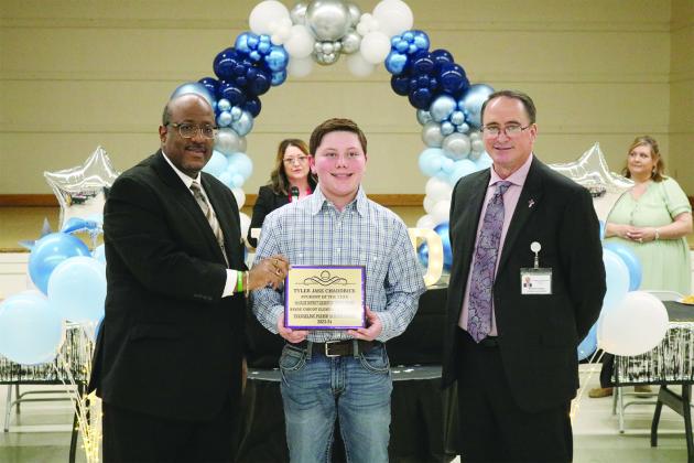 From left are Superintendent Lazard, 5th grade student of the year Tyler Jase Chaddrick, and Assistant Superintendent Lombas. 