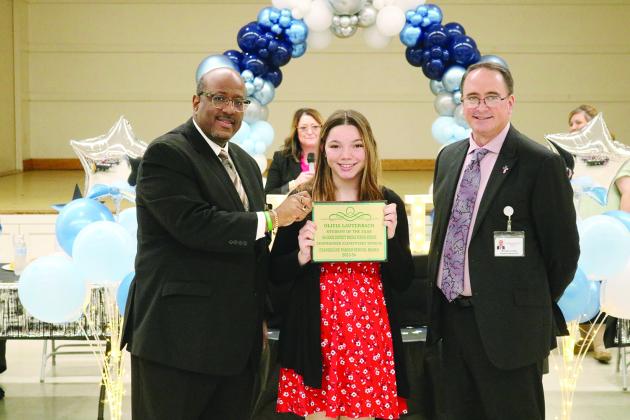 From left are Superintendent Lazard, 8th grade student of the year Olivia Lauterbach, and Assistant Superintendent Lombas. (Gazette photos by Tony Marks)