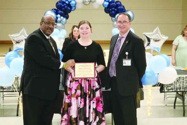 From left are Superintendent Darwan Lazard, 12th grade student of the year Daisy Berzas, and Assistant Superintendent Michael Lombas.