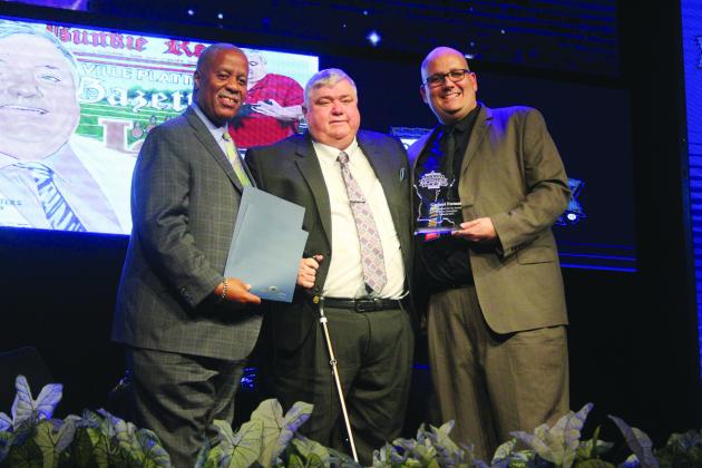 From left are State Senator Gerald Boudreaux, Distinguished Service Award recipient Garland Forman, and Louisiana Sports Writers Association President Raymond Partsch III. (Gazette photo by Tony Marks)