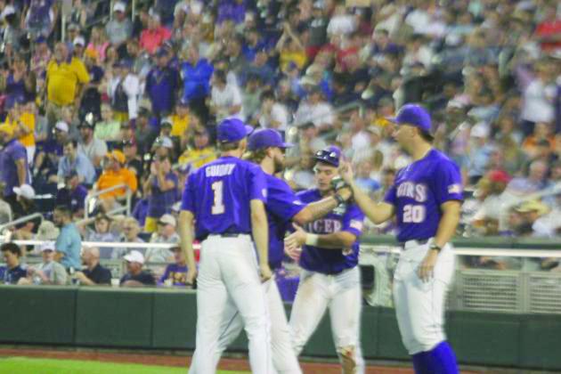 Paul Skenes (right) congratulates Riley Cooper (left) on earning a save in the Tigers’ opener.
