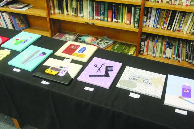 Pictured is some of the art that was on display during the first annual fine art exhibit at Mamou High School. (Gazette photo by Tony Marks)