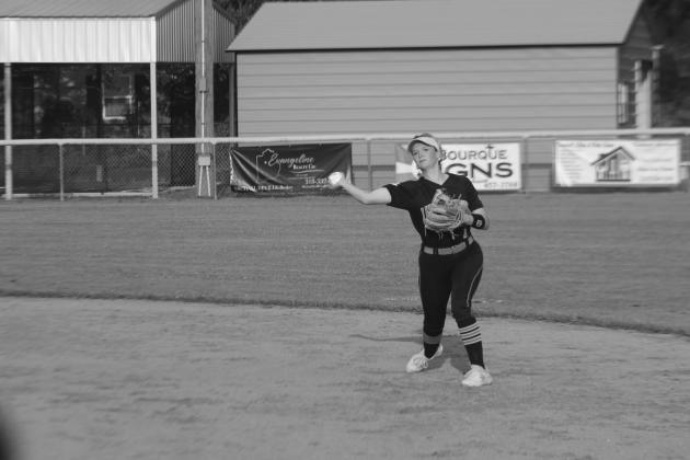 Pine Prairie softball second baseman Khaki Olson (7) throws the ball over to first base as she attempts to record an out. (Gazette photo by Rhett Manuel)