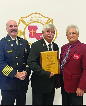 Mamou Fire Chief John “Garry” Reed was inducted into the Louisiana Fire Chief’s Hall of Fame. He is pictured in the center with Ville Platte Fire Chief Chris Soileau (left) and Ward 5 Fire Chief and LFRCA Board Member Bobby Guilbeau (right). (Photo courtesy of Chief Bobby Guilbeau)