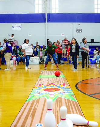 Dontravous Ben, of Mamou High School, competes in the bowling event of the  recent Special Olympics. The top three in each division are competing today at state in Lafayette. (Photo courtesy of Tommy Jones)