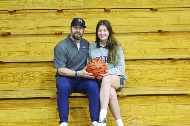 Sacred Heart High head coach Josh Harper (left) has been named the 2022 Ville Platte Gazette’s Coach of the Year for girls’ basketball in Evangeline Parish after leading his team to a postseason run after a three-win season a year ago.