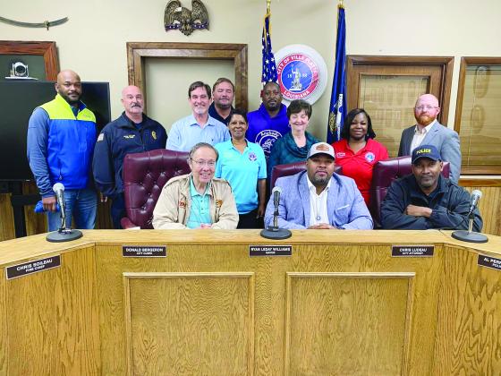 Pictured are (from left) back row- City Councilmen Tracey Jagneaux and Shawn Roy; middle row- Councilman Bryant Riggs, Fire Chief Chris Soileau, City Clerk Donald Bergeron, City Councilwomen Anna Frank, Faye Lemoine, and Christina Sam, and City Attorney Chris Ludeau; front row- KVPI General Manager Mark Layne, Mayor Ryan LeDay Williams, and Police Chief Al Perry Thomas. (Gazette photo by Nancy Duplechain)
