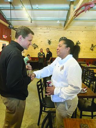 Newly hired McNeese mens’ basketball coach Will Wade (left) meets with the head coach of the State Champion Oakdale Lady Warriors Renotta Edwards. (LSN photo by Tony Marks)