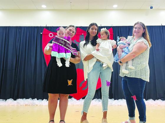 BABY MISS TOURNOI COURT - Shown, from left, are the members of the Baby Miss Tournoi Court. They are Queen August Manuel; Bentley Jo Buller, first runner-up; and Jolie Harbour, second runner-up.