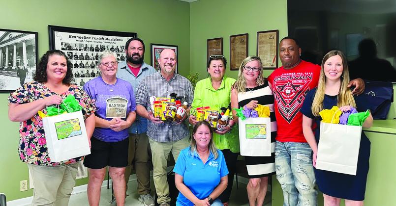 Shown, from left, are EPTC board member Melissa Clavier, EPTC vice president Wanda Verrette, board member Tony Marks, Trey Job with the City of Bastrop, Kathy Danielson with the City of Bastrop, EPTC president Opal Andrus, second vice president Derrell Thomas and EP Tourism Marketing Manager Elizabeth West. Kneeling in front is board member Paula Darbonne. (Photo courtesy of Elizabeth West)