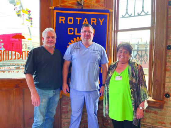 DR. CORMIER DISCUSSES STISOL - During the December 20, meeting of the Ville Platte Rotary Club, Dr. Jeb Cormier (center) spoke with the group about services at his STISOL clinic in Ville Platte. He is shown with Rotary President Larry Lachney (left) and Rotarian Mable Foreman (right). (Gazette photo by Heather Bogard)