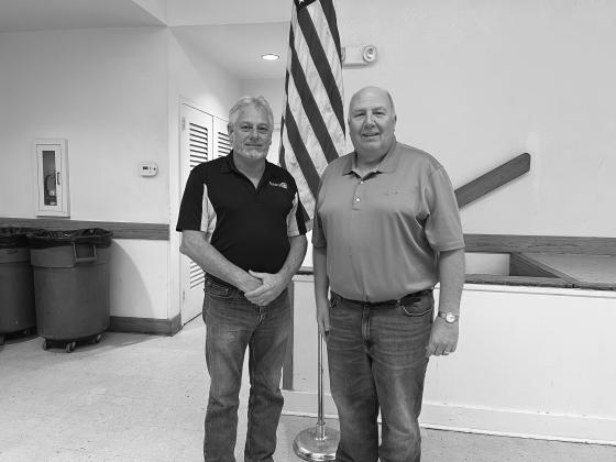 DEROUSELLE TALKS 911 SERVICES - During the December 13, meeting of the Ville Platte Rotary Club, Pat Derouselle (right) spoke with the group about 911 services in Evangeline Parish. He is shown with Rotary President Larry Lachney (left). (Gazette photo by Heather Bogard)