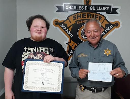 Pictured on the left is scholarship recipient Sawyer Gunter with Evangeline Parish Sheriff Charles Guillory. The scholarship was an academic scholarship from the Louisiana Sheriffs’ Scholarship Program. (Photo courtesy of EPSO)