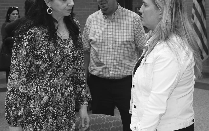 State Rep Julie Emerson, right, talks with St. Landry Parish Assessor Sherri Zeringue McGovern at a recent Eunice Rotary Club meeting. At center is Eunice Mayor Scott Fontenot. Emerson, who heads the House Ways and Means Committee, spoke about tax issues at the meeting held at LSUE. (LSN photo by Harlan Kirgan)