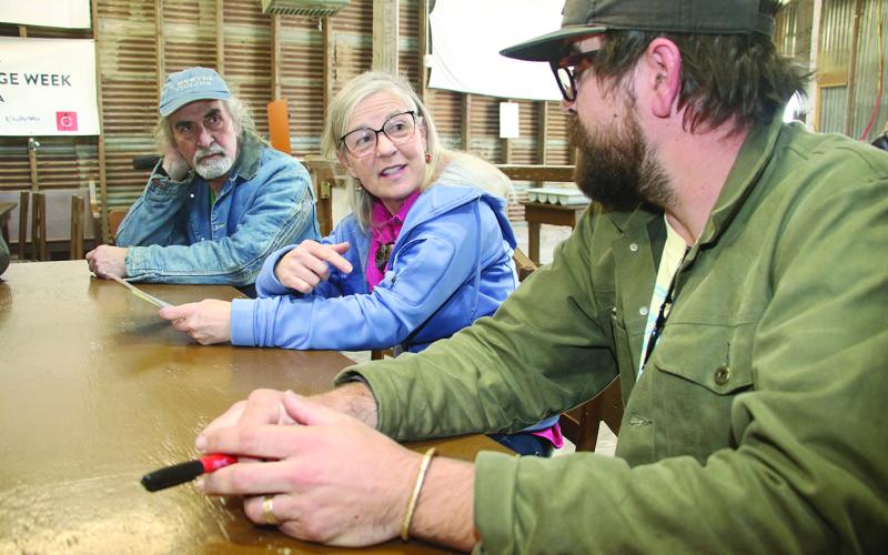 Jeanne Solis, Folk Roots executive director, center, explores questions about culture with from left, Pete Hobbie, of West Virginia, and Jo Vidrine, program and artistic director of Dewey Balfa Cajun and Creole Heritage Week at Lakeview Park &amp; Beach, north of Eunice off La. 13. (LSN photo by Harlan Kirgan)