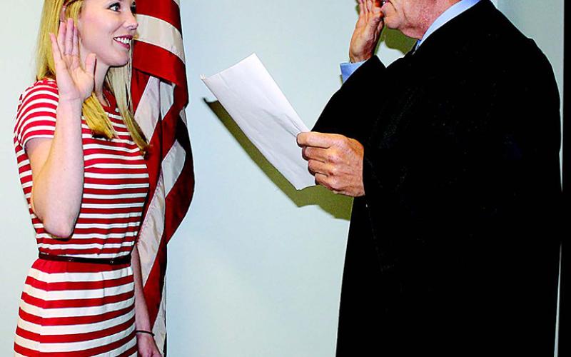 Elizabeth West (left) takes the oath of office from Judge Chuck R. West on Thursday inside West’s courtroom at the Evangeline Parish Courthouse. In 2016, West was first sworn in as a board member of the Acadiana Area Human Services District, which promotes awareness about health issues and overseas health units in seven parishes, including Evangeline Parish. She was reappointed for another term by Governor John Bel Edwards. (Gazette file photo)