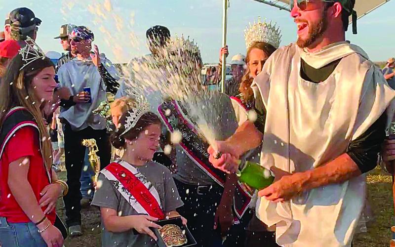 Tournoi Champion John Ross Guillory celebrates his victory with a celebratory champagne shower. For more scenes from this year’s running of the event, turn to Page 12. (Photo by Elizabeth West)