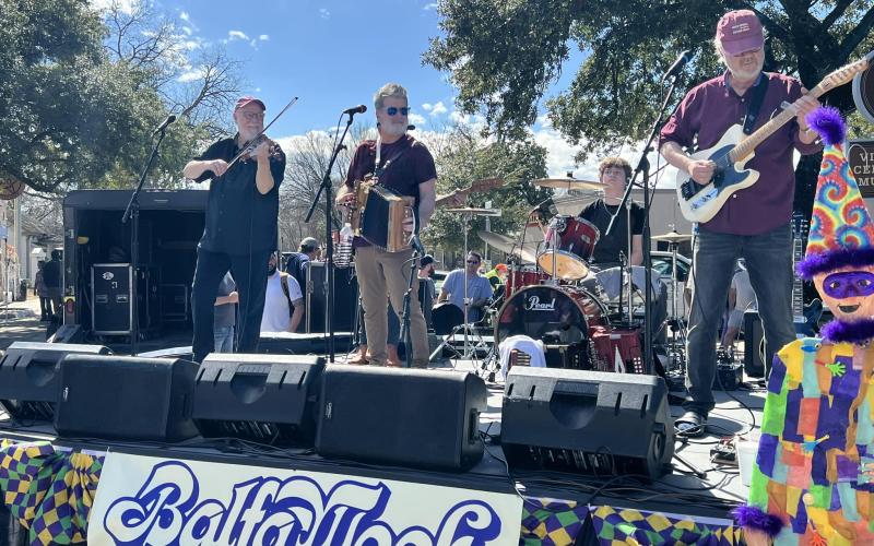 Pictured in the right photo are Steve Reilly and the Mamou Playboys as they perform for the street dance. (Gazette photo by Tony Marks)