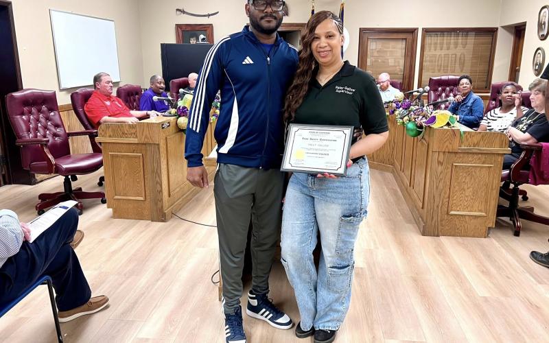 Jail Supervisor Haley Gallow (right) was recognized for achieving her State Food Safety Certification. She is pictured with City Councilman Bryant Riggs (left). (Photo courtesy of Ville Platte Police Department)