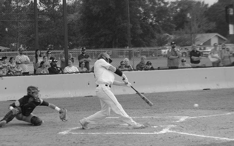 Caden Askey (7) connects with a pitch in a game against Church Point during a best-of-three playoff series held at Pine Prairie. The Panthers now play a best-of-three series at Red River in the second round. (Gazette photo by Rhett Manuel)
