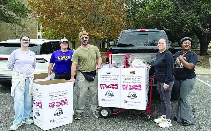 Paramedic Field Supervisor Annie Dillard (second from right) with Paul Ganucheau, Toys for Tots Regional Coordinator (middle) and Toys for Tots volunteers. (Photo courtesy of Acadian Ambulance)